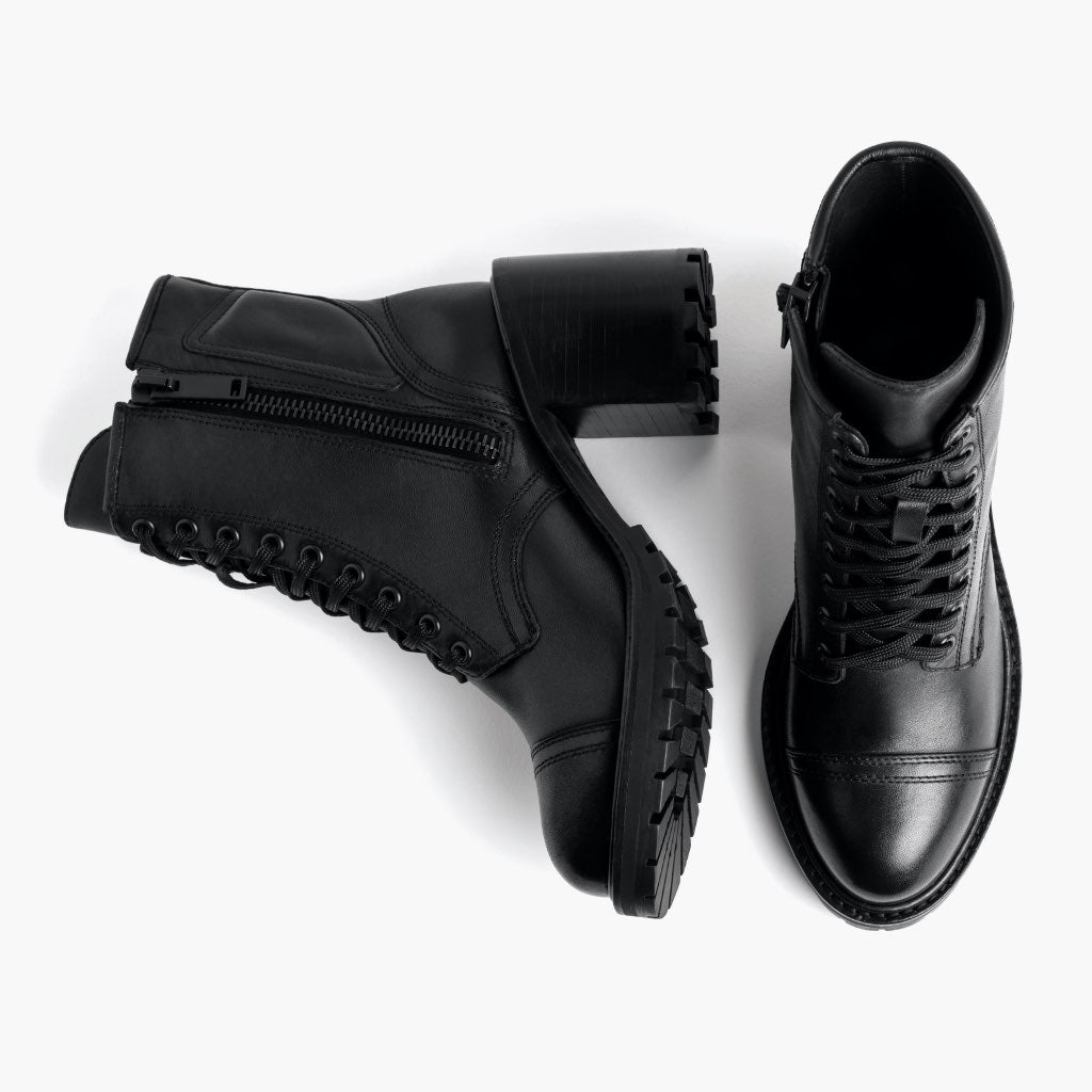 High-Traction Rubber Outsole & Lug Tread Pattern on Rebel Negro Botas de cuero para Mujer