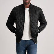 
Black Satin Varsity Jacket - Vista posterior con hombros definidos y bajo impecable