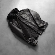 
Detalle artesanal del bajo en Highschool Black Leather Jacket