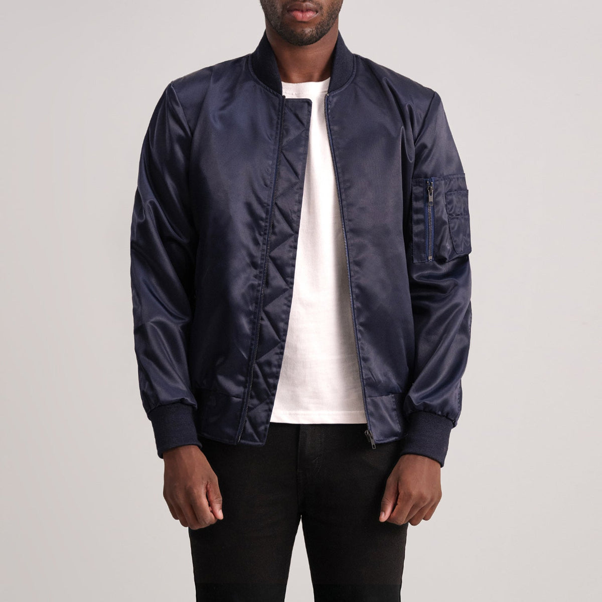 Quinton MA-1 Azul Cazadora Bomber de Cuero para Hombre - Vista de perfil lateral con corte ergonómico de manga